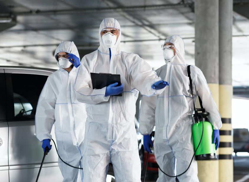 Pest Control Workers Doing Inspection Task at Commercial Parking